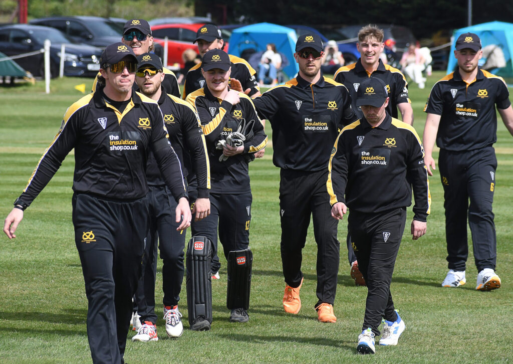 Staffordshire County Cricket Club captain James Kettleborough leads the players off the pitch after fielding against Norfolk