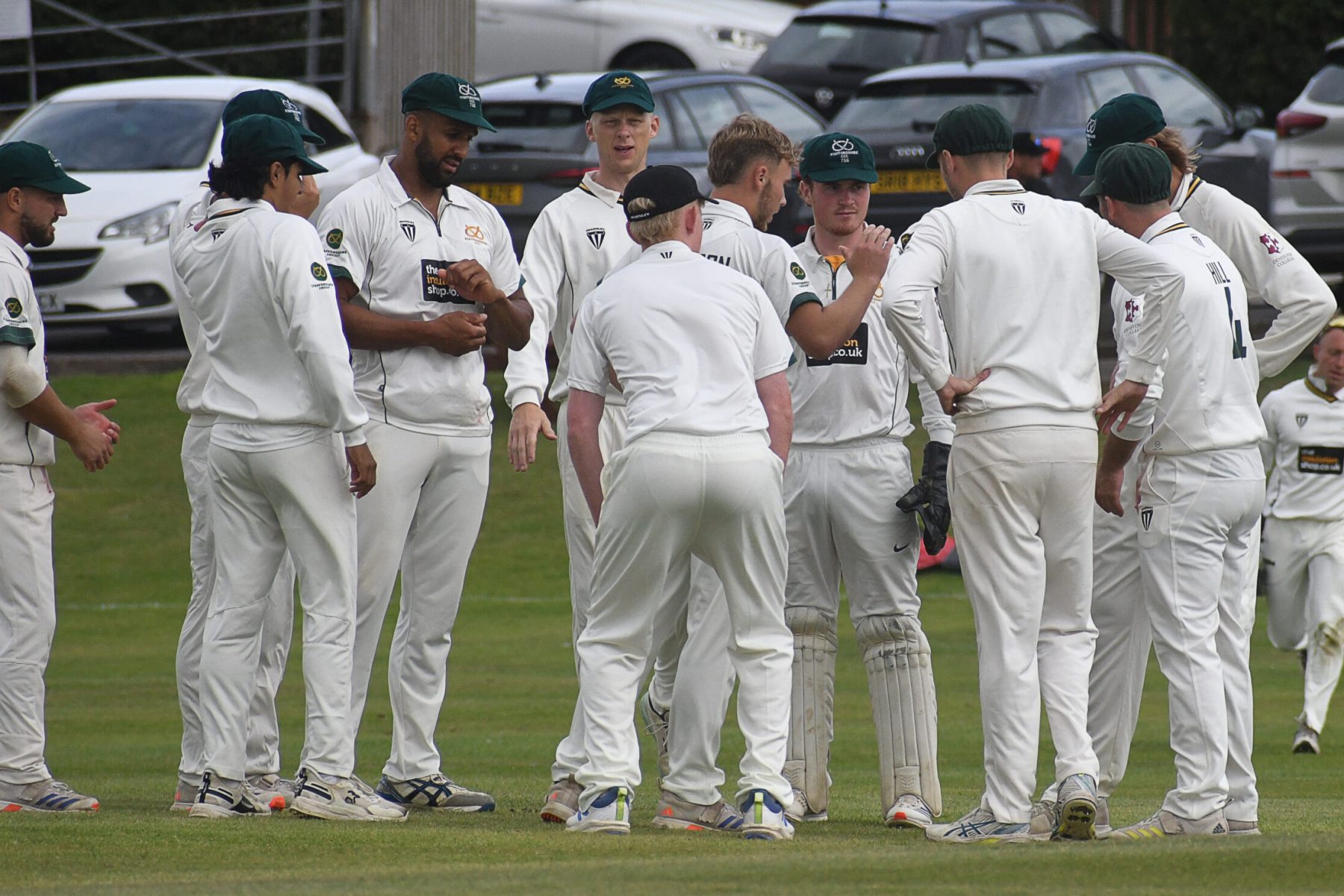 Staffordshire celebrate taking a Lincolnshire wicket on the second day at Checkley.