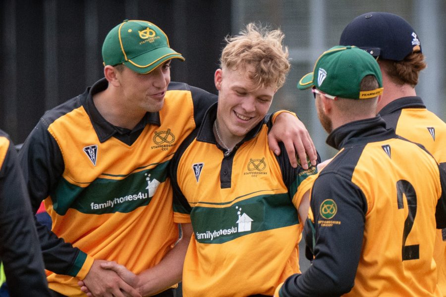 Staffordshire seamer Rory Haydon is congratulated after taking the wicket of Leicestershire's Rishi Patel in the NCCA Showcase Game.