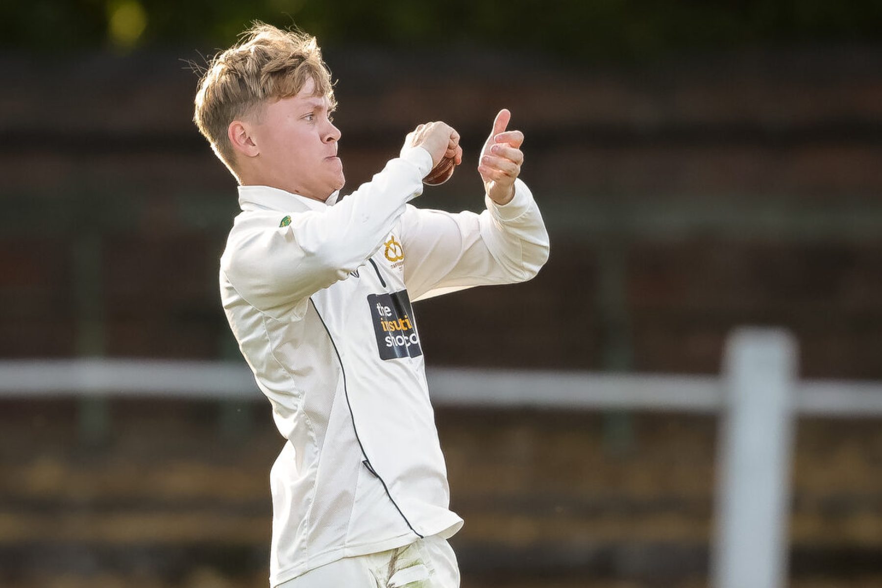 Staffordshire spinner Oliver Tucker bowls in the NCCA Championship final